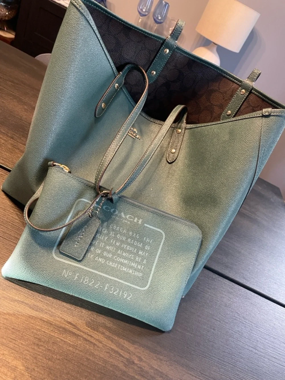Coach Classic Brown Signature Canvas ReversibleTote with Teal Wristlet.